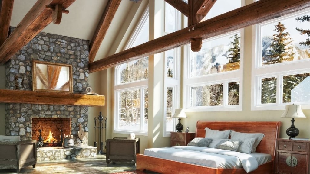 The large cherry wood beams and stone fireplace make this a lovely bedroom.