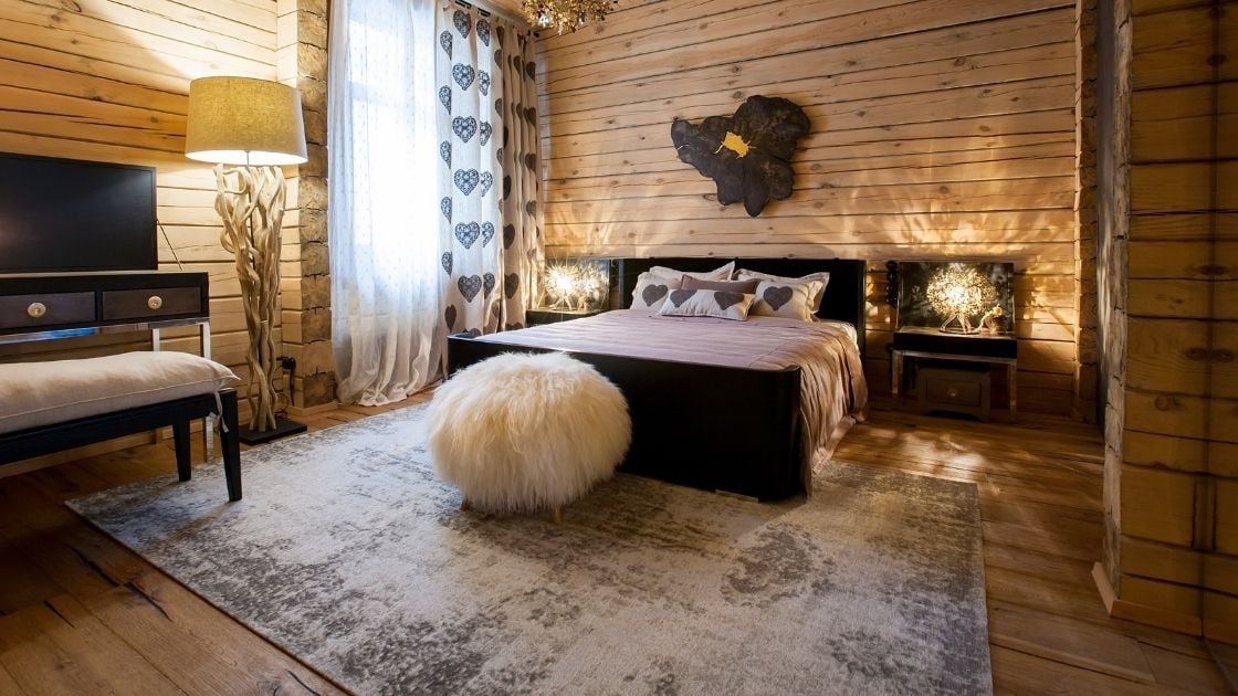 There is wood everywhere in this rustic bedroom
