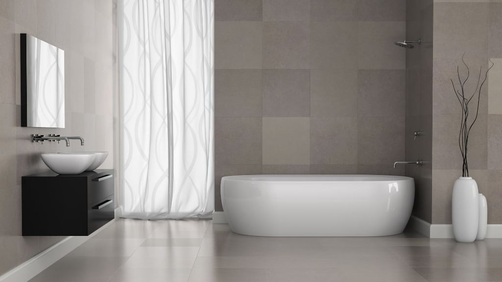 Gray wall and floor tiled bathroom