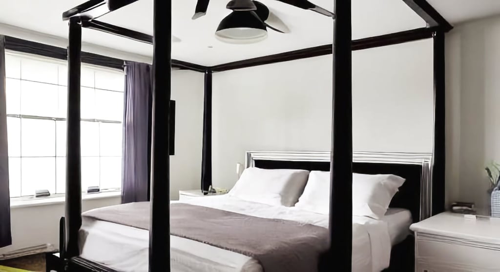 Poster bed in modern male bedroom