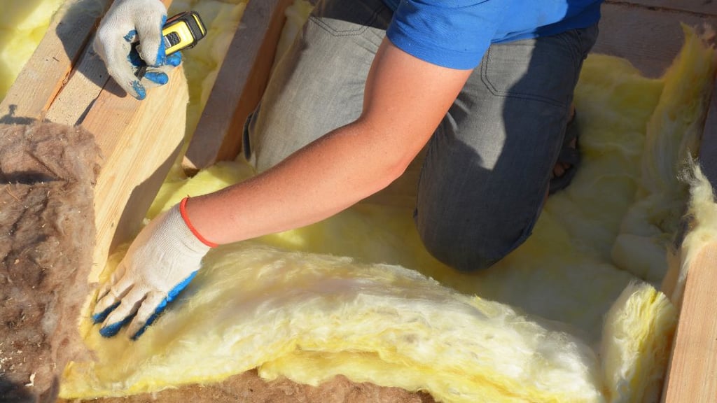 Installing Fiberglass Batt attic insulation