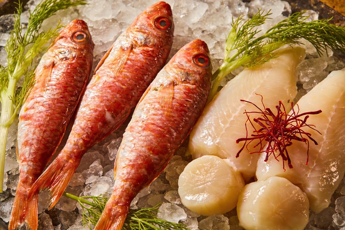 Aggressive boiling of the authentic Marseille bouillabaisse base to emulsify olive oil and fish gelatin