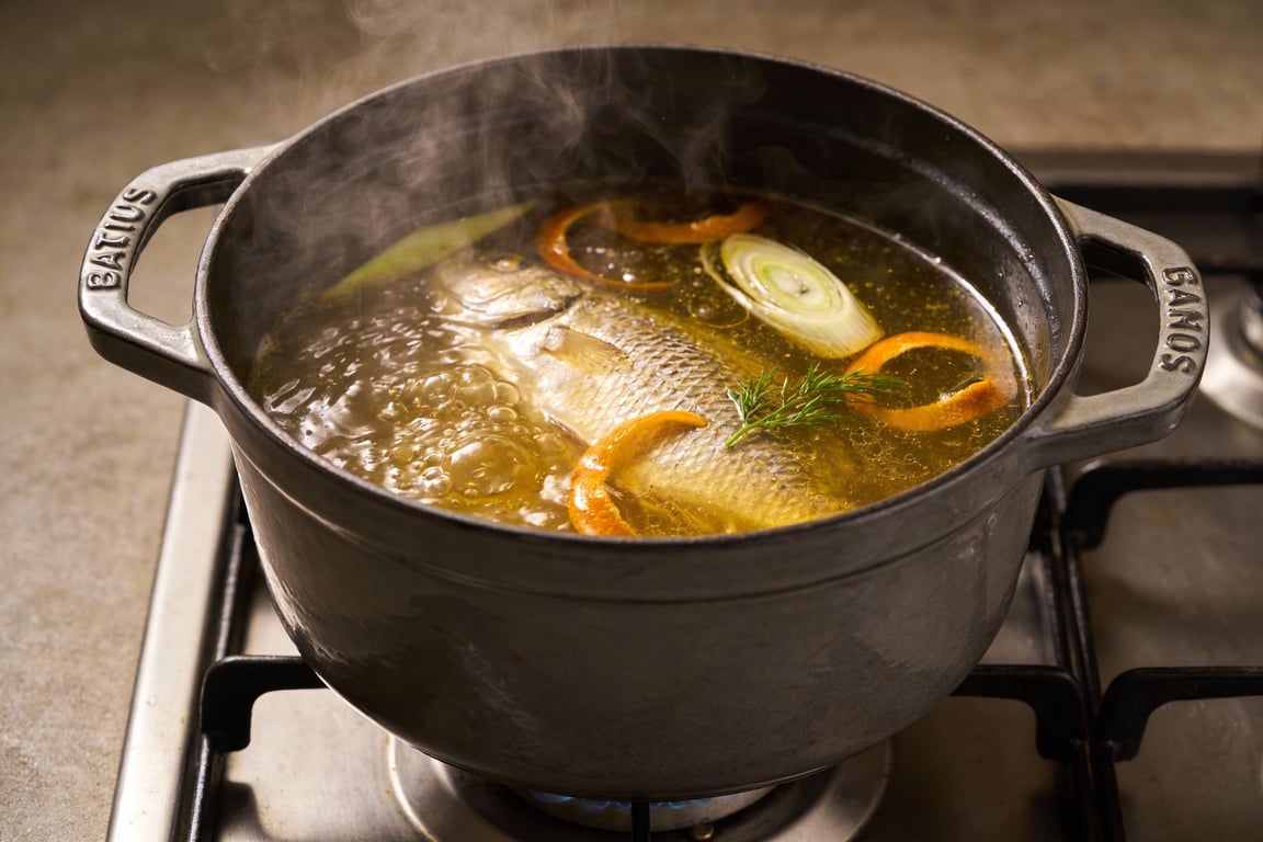 The finished authentic Marseille bouillabaisse served with toasted croutons and handmade rouille