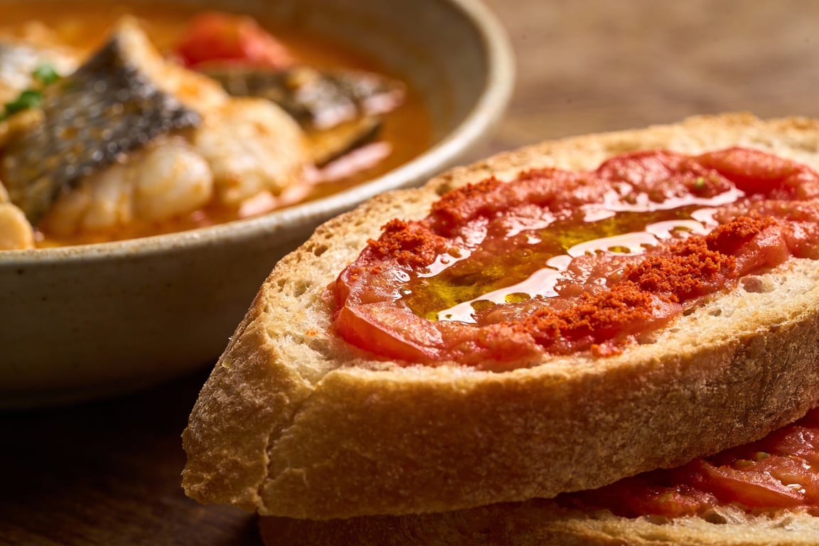 Authentic Spanish Suquet de Peix served in a cazuela