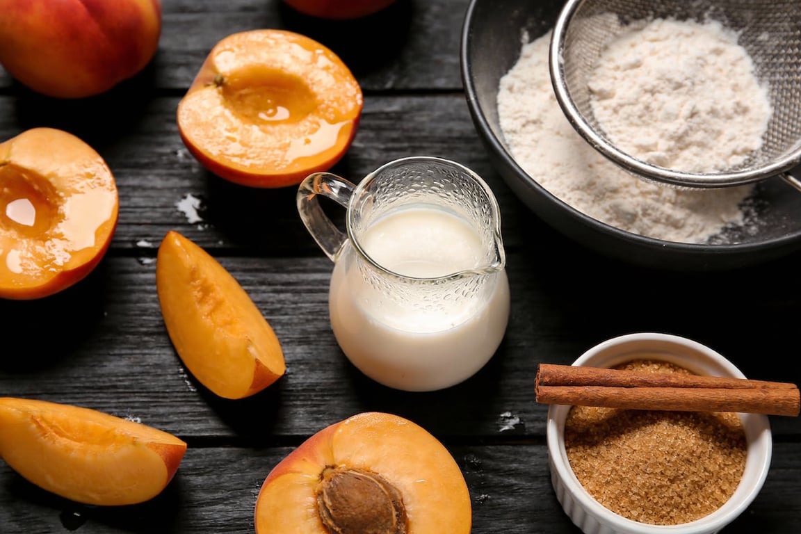 Folding egg whites into buttermilk batter for fluffy pancakes