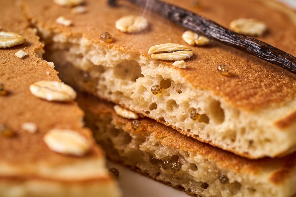 Toasted oats being milled for Oat Flour Pancakes