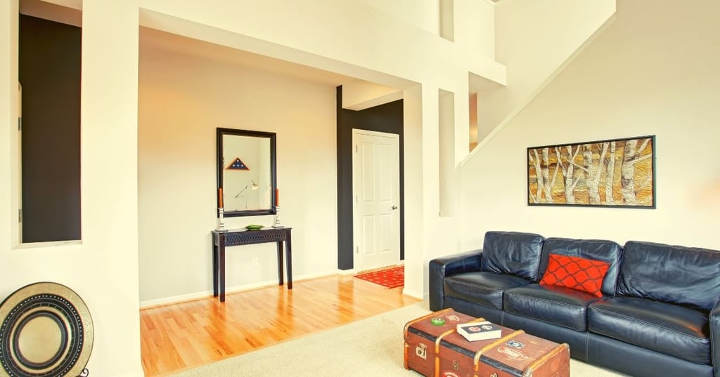Use furniture and layout to make the most of your tiny room with high ceilings.