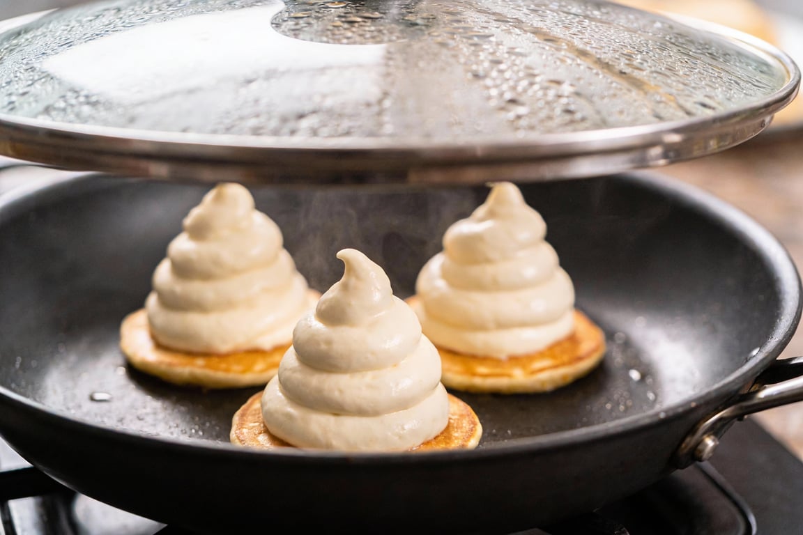 Folding the fluffy Japanese Soufflé Pancakes batter