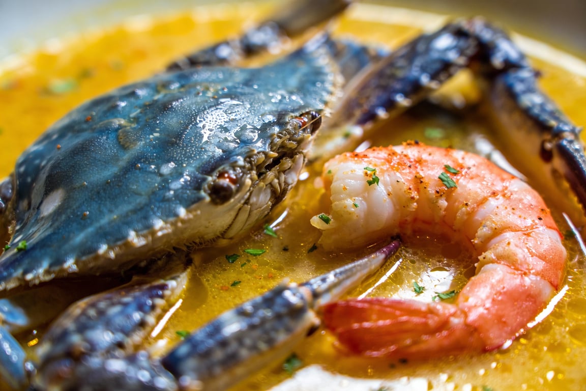 Lowcountry Bouillabaisse stock ingredients with toasted shrimp heads