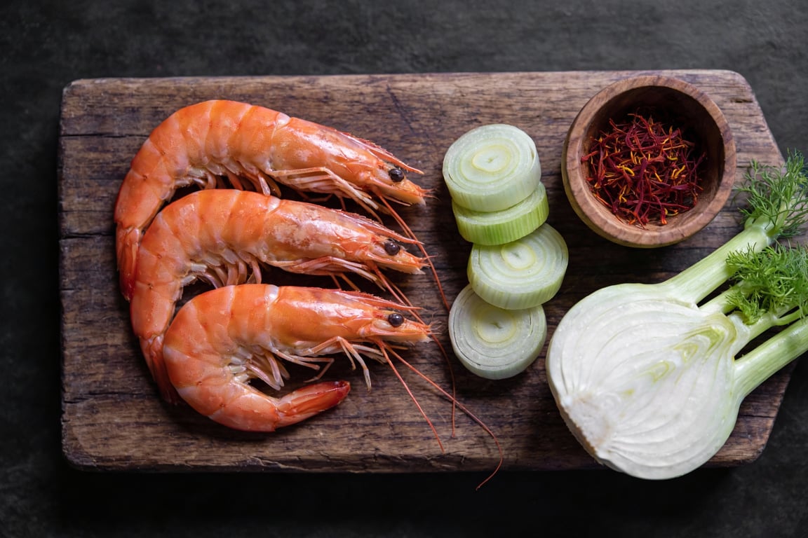 Poaching blue crab and shrimp in the golden saffron broth