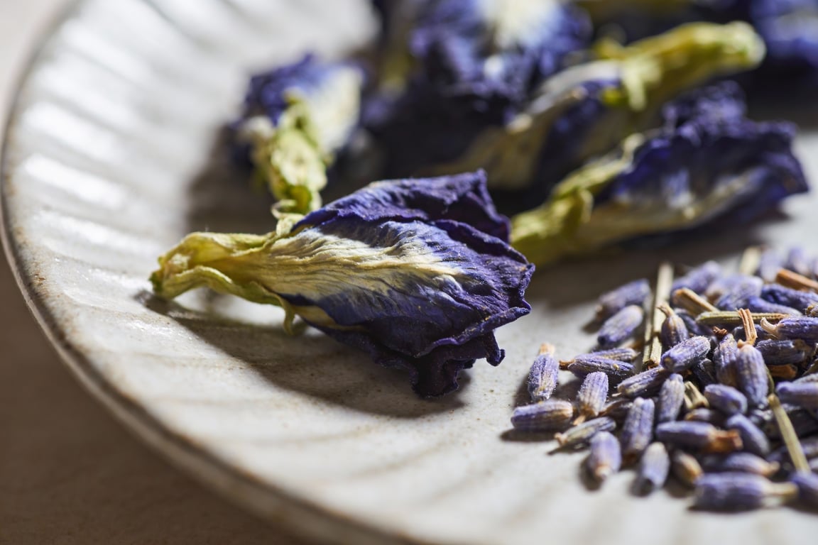 Butterfly pea flower drink being poured - color changing lavender lemonade