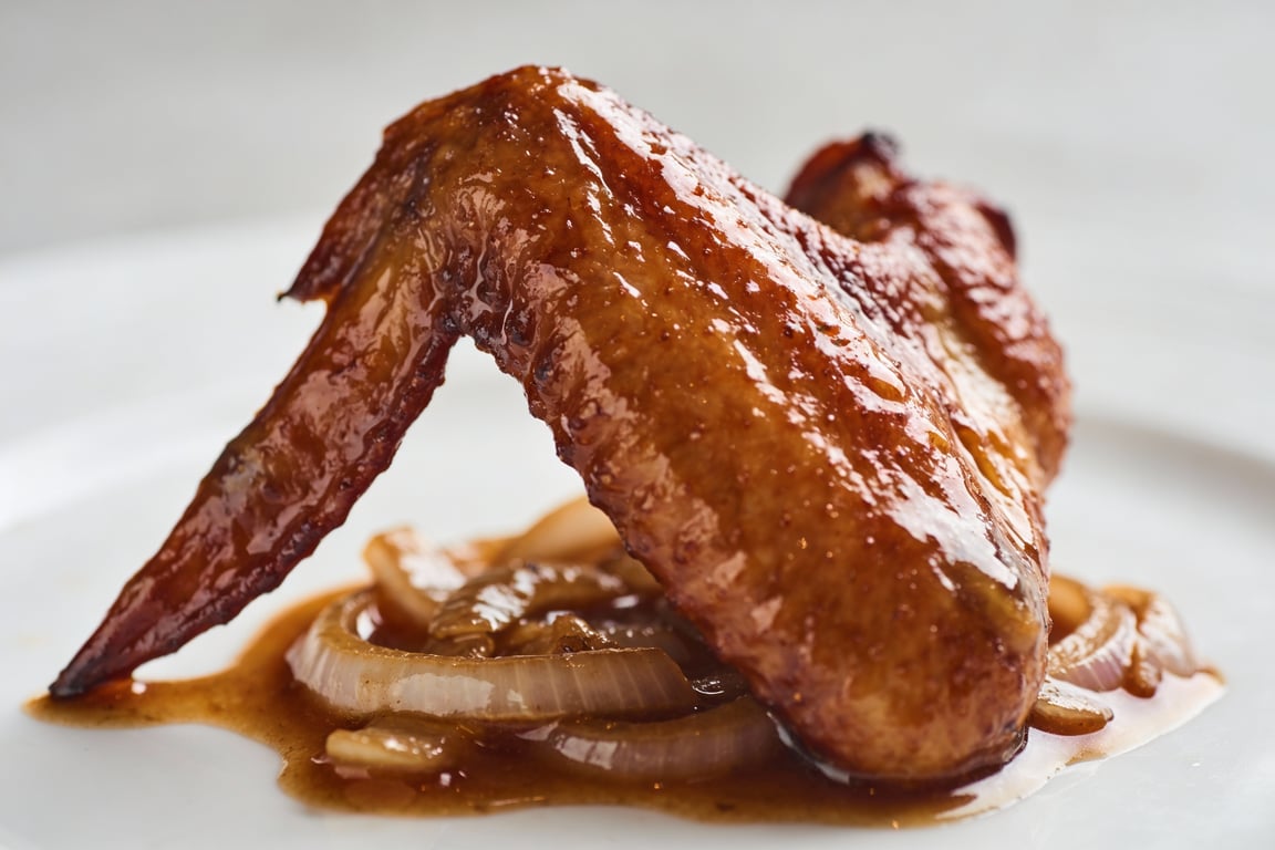 Searing Smothered Turkey Wings in a skillet