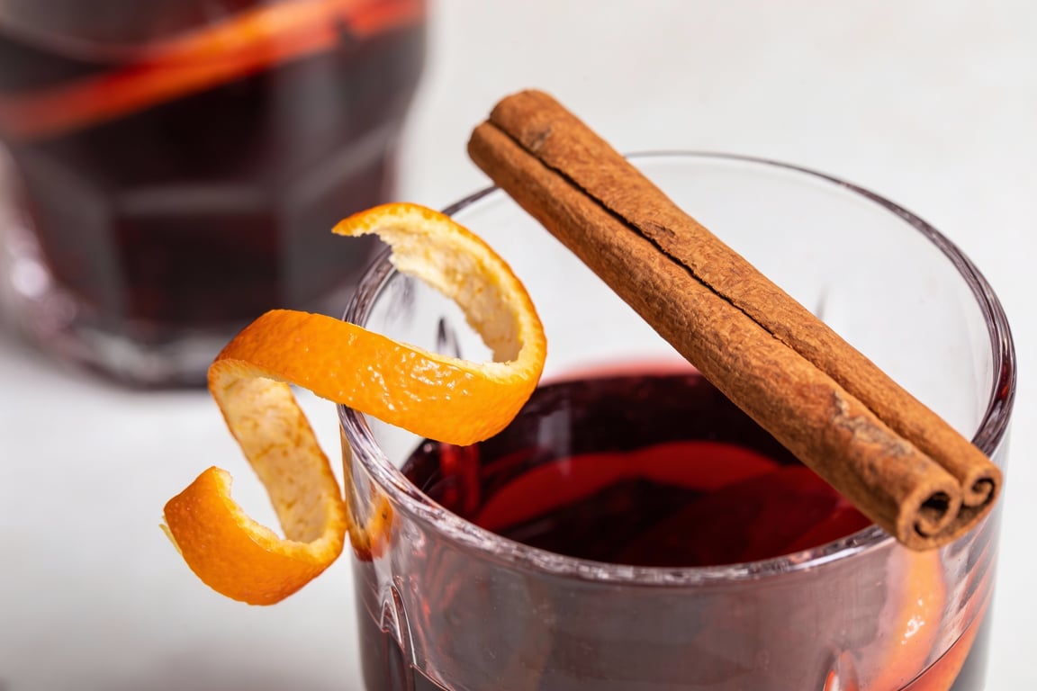 Pouring red wine to create a festive Holiday Red Wine Punch