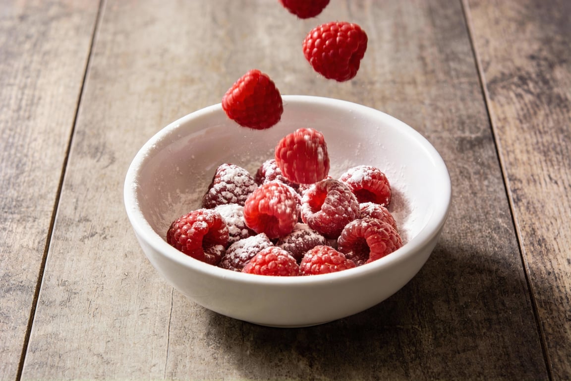 Close up of the cream cheese swirl technique on the muffins