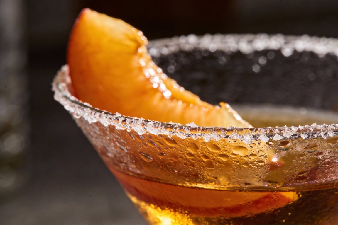 Ingredients for a Southern Peach & Bourbon Manhattan including peach nectar and bourbon