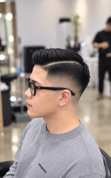 Clean fade with a textured top and defined parting.