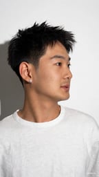 Textured hairstyle with a clean fade and defined edges.