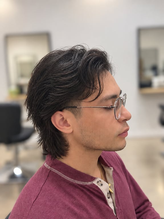Styled long hair with textured layers and a natural finish.