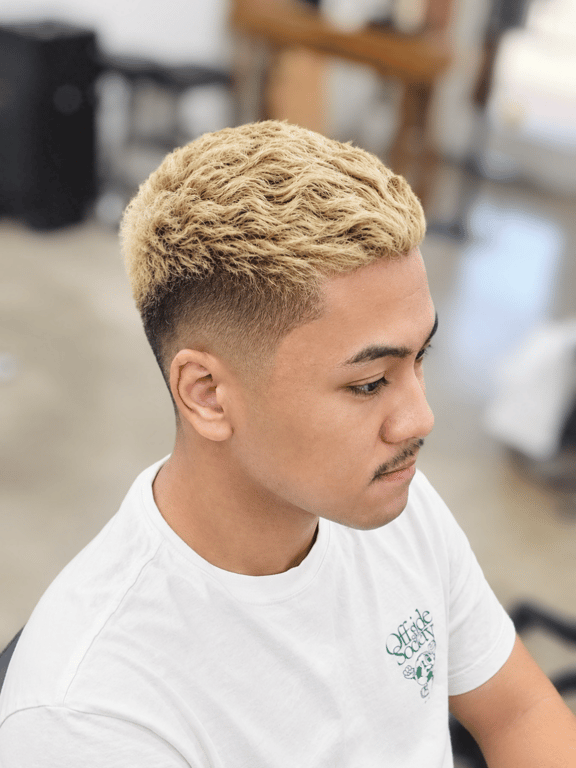 Textured blonde crop with a clean fade.