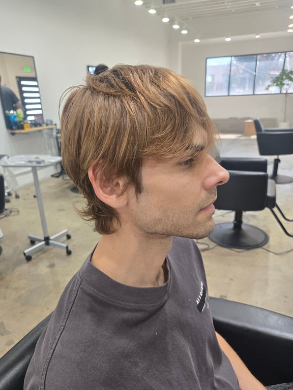 Soft layered haircut with natural texture.