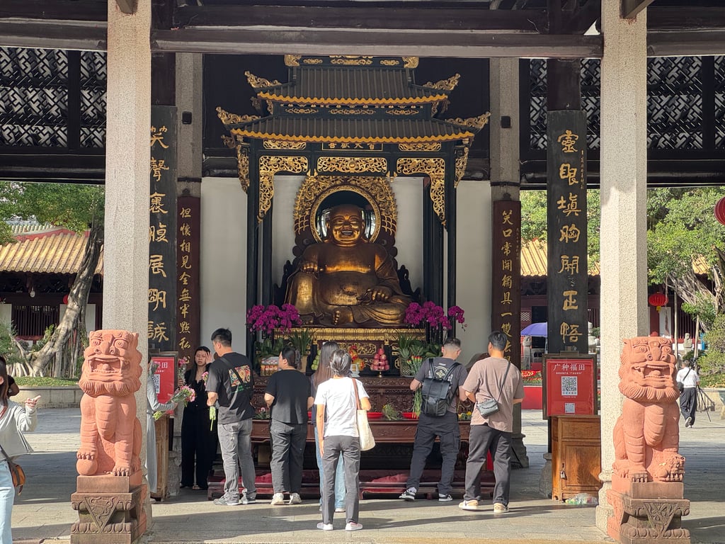 Laughing Buddha statue at the temple