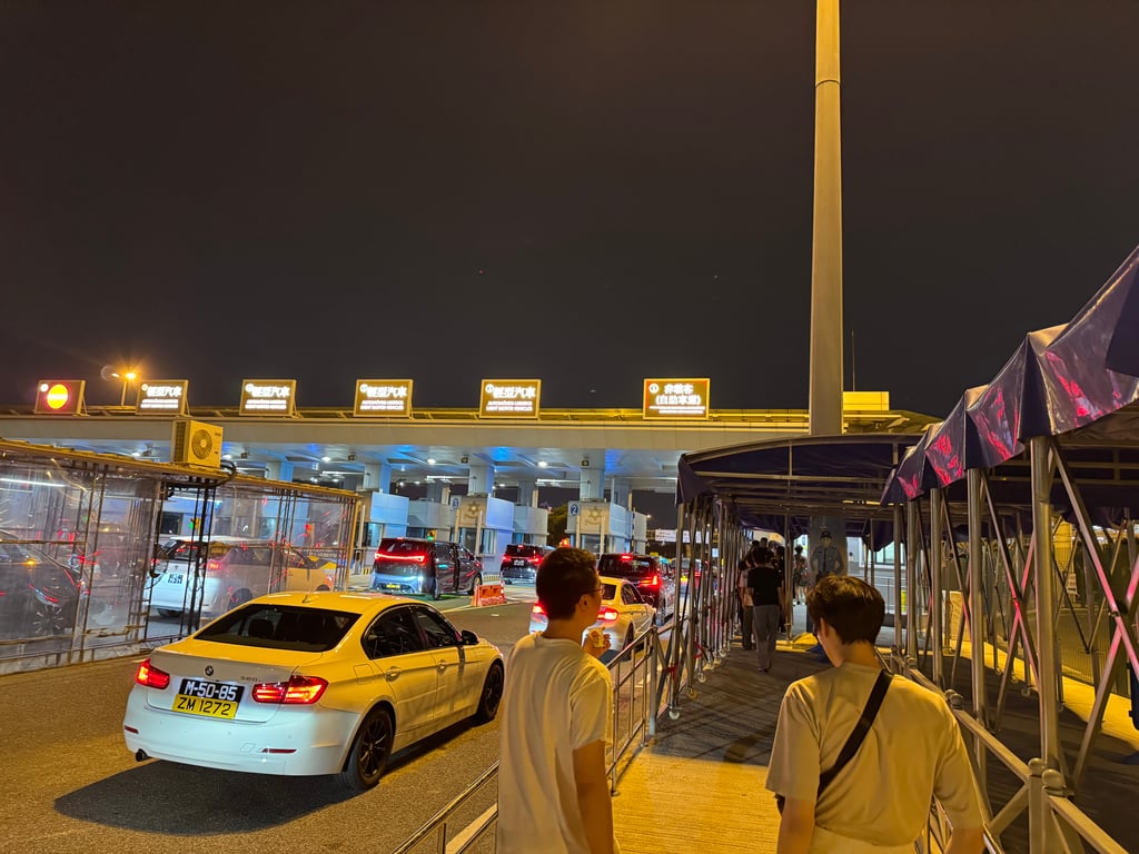 At the Macao border, we were asked to step out and walk across the border. All cars have multiple license plates, one for each region that they are registered in (Macao / Hong Kong / Mainland China).