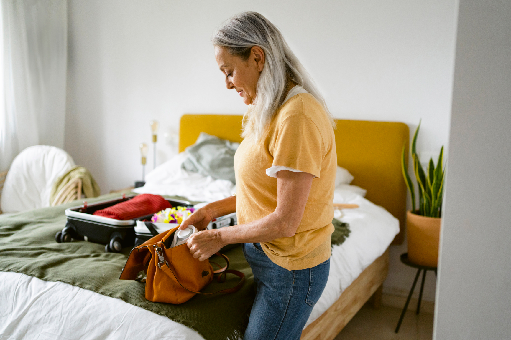 Woman packing a suitcase for a trip