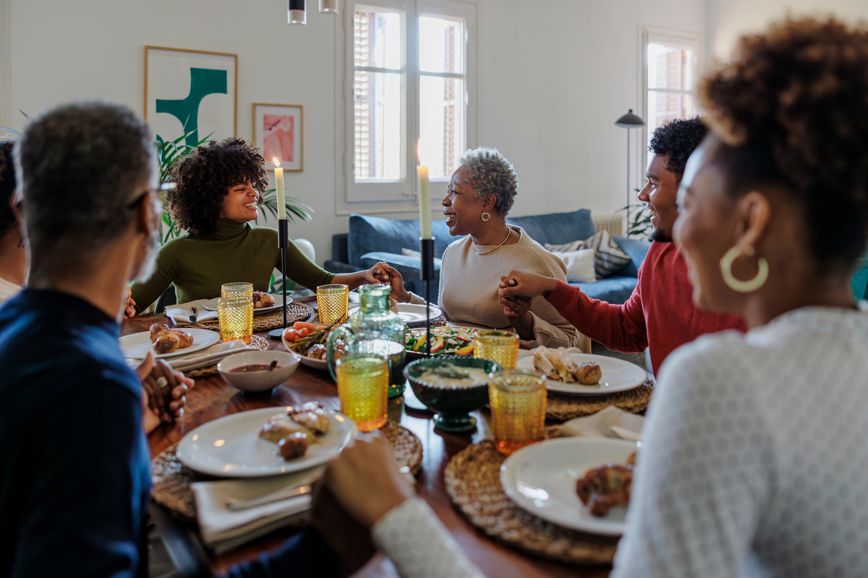 Family at a table, eating a meal.