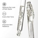 The Ordinary Alpha Arbutin Serum clear droplets on glass surface