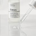 The Ordinary Hyaluronic Acid 2% + B5 serum clear droplets on glass surface