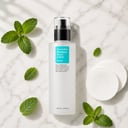 Cosrx Two in One Poreless Liquid on surface with cotton pad