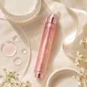 Medicube Collagen Glow Booster Serum with milk splash and collagen droplets