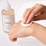 The Ordinary Glycolic Acid 7% Exfoliating Toner on a white marble surface