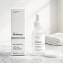 The Ordinary Niacinamide 10% + Zinc 1% Serum on white marble vanity