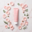 Medicube PDRN Pink Cream with pink flowers and water droplets
