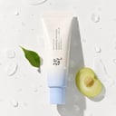 Beauty of Joseon Aqua Fresh Sunscreen on marble surface with water droplets