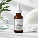 The Ordinary Caffeine Solution 5% EGCG on vanity with eye care routine