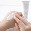 Applying Dr.Althea 345 Relief Cream on back of hand - lightweight gel texture