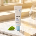 Medicube Zero Pore Moisture Sun Serum on marble surface in sunlight