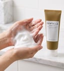 Hands lathering Skin1004 Centella Ampoule Foam into rich foam