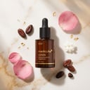 Medicube Glutathione Glow Serum with cocoa beans and pink flowers