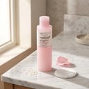 Medicube PDRN Pink Niacinamide Milky Toner on white marble vanity