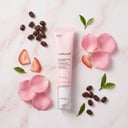 Medicube PDRN Eye Cream with pink petals and coffee beans