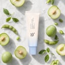 Beauty of Joseon Aqua Fresh Sunscreen with green plum and soybean on surface