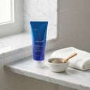 Medicube Zero Pore Blackhead Mud Mask on white marble bathroom shelf