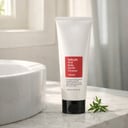 COSRX Salicylic Acid Daily Gentle Cleanser next to bathroom sink