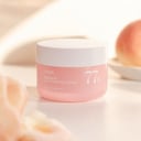 Anua Peach 77 Niacin Enriched Cream on vanity with brightening routine