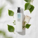 COSRX Birch Sap Lotion with birch leaves and water droplets