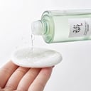 Beauty of Joseon Green Plum Toner clear liquid poured onto white cotton pad