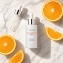 Tirtir Pure Vitamin C24 Serum on surface with dropper